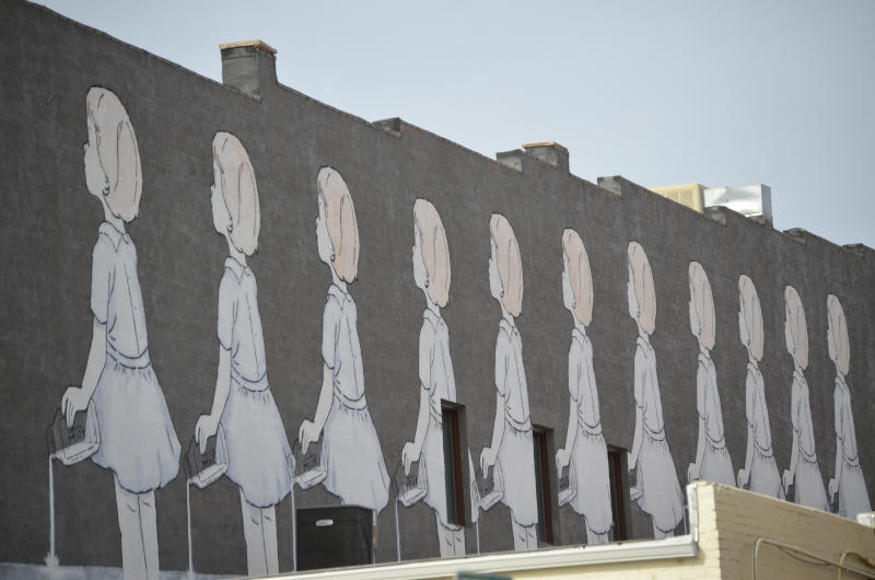 Mural of girls spilling milk